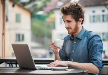 relaxed man using laptop